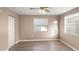 Comfortable bedroom with light walls, ceiling fan, and large windows at 1513 W Mohawk Ave, Tampa, FL 33603