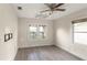 Bedroom with ceiling fan, hardwood floors, and windows providing ample natural light at 1513 W Mohawk Ave, Tampa, FL 33603