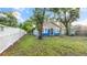 Cozy single-story home featuring a painted exterior, a spacious yard, and mature trees at 1513 W Mohawk Ave, Tampa, FL 33603
