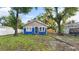 Front exterior of a cute, single-story home with nice yard and fresh paint at 1513 W Mohawk Ave, Tampa, FL 33603