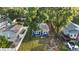 Charming blue single-story home with mature trees and a well-maintained front yard at 1513 W Mohawk Ave, Tampa, FL 33603