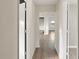 Hallway with wood floors and doorways providing access to other rooms at 1513 W Mohawk Ave, Tampa, FL 33603