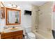 A bathroom with a bathtub, and a vanity with sink basin, great for relaxation at 1667 E Orangeside Rd, Palm Harbor, FL 34683