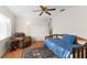 Bedroom with hardwood floors, recliner, and a daybed. A nice area for reading and relaxation at 1667 E Orangeside Rd, Palm Harbor, FL 34683