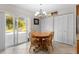 Bright dining area with sliding glass doors, chandelier, and access to the backyard at 1667 E Orangeside Rd, Palm Harbor, FL 34683