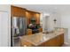 Stylish kitchen features stainless appliances, granite counters, and ample cabinet space at 1667 E Orangeside Rd, Palm Harbor, FL 34683