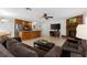 Open-concept living area features a brick fireplace and tile flooring at 1667 E Orangeside Rd, Palm Harbor, FL 34683