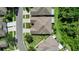 Bird's-eye view of the property's well-maintained roof, backyard, and surrounding neighborhood at 1822 Sassafras Dr, Wesley Chapel, FL 33543