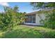 Beautiful backyard featuring a lanai, patio, and lush green lawn, perfect for outdoor enjoyment at 1822 Sassafras Dr, Wesley Chapel, FL 33543