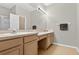 Bathroom featuring a double vanity, ample counter space, and neutral tile flooring at 1822 Sassafras Dr, Wesley Chapel, FL 33543