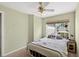 Cozy bedroom featuring a ceiling fan, window, and comfortable bed, creating a peaceful retreat at 1822 Sassafras Dr, Wesley Chapel, FL 33543