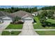 Charming home featuring a well-manicured lawn, two-car garage, and inviting curb appeal at 1822 Sassafras Dr, Wesley Chapel, FL 33543