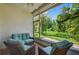Relaxing lanai with comfortable seating and scenic views of lush greenery, ideal for unwinding outdoors at 1822 Sassafras Dr, Wesley Chapel, FL 33543