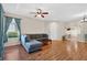 Comfortable living room with hardwood floors, a ceiling fan, and a bright window at 1822 Sassafras Dr, Wesley Chapel, FL 33543