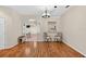 Bright dining room with hardwood floors and an open layout to the kitchen at 1822 Sassafras Dr, Wesley Chapel, FL 33543
