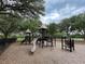 Neighborhood playground with slides, monkey bars, and climbing structures on a bed of mulch at 18930 Wood Sage Dr, Tampa, FL 33647