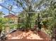 Bright screened porch featuring plants and brick flooring at 18930 Wood Sage Dr, Tampa, FL 33647