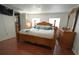 Cozy bedroom with a wooden bed frame and lots of natural light at 2108 W Comanche Ave, Tampa, FL 33603