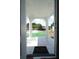 View of the welcoming front porch with white pillars and a tiled floor at 2108 W Comanche Ave, Tampa, FL 33603