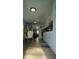 Bright eat-in kitchen with white cabinets, stainless steel refrigerator and dining table at 2108 W Comanche Ave, Tampa, FL 33603