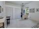 Bright bedroom with a ceiling fan, dual closets, and a work space at 2406 Dana Dr, Safety Harbor, FL 34695