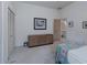 Bedroom with closet, dresser, and access to the bathroom at 2406 Dana Dr, Safety Harbor, FL 34695