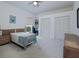 Spacious bedroom with large closet, neutral carpet, and ceiling fan at 2406 Dana Dr, Safety Harbor, FL 34695
