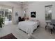 Well-lit bedroom features a ceiling fan, desk area and sliding glass door access to the pool area at 2406 Dana Dr, Safety Harbor, FL 34695