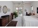 Bright bedroom with sliding door access to pool, includes a dresser, desk and plant for added appeal at 2406 Dana Dr, Safety Harbor, FL 34695