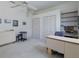 Bright bedroom features a ceiling fan, a desk, a seating area, and ample closet space at 2406 Dana Dr, Safety Harbor, FL 34695