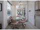 Dining area with pool views through glass doors at 2406 Dana Dr, Safety Harbor, FL 34695