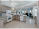 Bright kitchen featuring tile floors, updated appliances, and plenty of counter space at 2406 Dana Dr, Safety Harbor, FL 34695