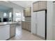 Eat-in kitchen featuring classic appliances, adjacent dining area, and refrigerator at 2406 Dana Dr, Safety Harbor, FL 34695