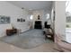 Open-concept living room with bright interior, ceiling fan, and natural light at 2406 Dana Dr, Safety Harbor, FL 34695
