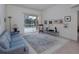Bright living room with a sliding glass door to the pool area offering seamless indoor/outdoor living at 2406 Dana Dr, Safety Harbor, FL 34695