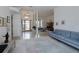 Spacious living room with tile flooring, with view of dining area and main entry at 2406 Dana Dr, Safety Harbor, FL 34695