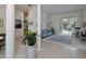 Open-concept living room with view to the pool, featuring columns and tile flooring, great for entertaining at 2406 Dana Dr, Safety Harbor, FL 34695