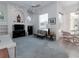 Inviting living room with a fan, natural light, and dining area access at 2406 Dana Dr, Safety Harbor, FL 34695