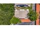 Overhead view of community featuring mature trees, parking, and landscaping at 2442 Enterprise Rd # 6, Clearwater, FL 33763