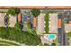 An aerial view features a well maintained community with lush landscaping and a swimming pool at 2442 Enterprise Rd # 6, Clearwater, FL 33763