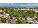 The aerial view shows a neighborhood surrounded by lush green trees with city views at 2442 Enterprise Rd # 6, Clearwater, FL 33763