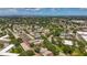 An aerial shows the community's layout, surrounded by greenery and neighborhood features at 2442 Enterprise Rd # 6, Clearwater, FL 33763