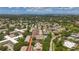 An aerial view shows the mature landscaping, layout, and surrounding neighborhood at 2442 Enterprise Rd # 6, Clearwater, FL 33763