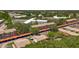 Aerial view of community, highlighting its mature trees, covered parking, and well-maintained buildings at 2442 Enterprise Rd # 6, Clearwater, FL 33763