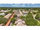 An aerial shows the community's proximity to local amenities and lush green surroundings at 2442 Enterprise Rd # 6, Clearwater, FL 33763