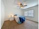 Sunlit bedroom with a ceiling fan and large window, offering a serene and relaxing atmosphere at 2442 Enterprise Rd # 6, Clearwater, FL 33763