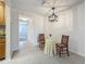 Light dining area with decorative lighting and a view into the kitchen at 2442 Enterprise Rd # 6, Clearwater, FL 33763