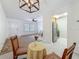 Open dining area with a view into the living room and kitchen at 2442 Enterprise Rd # 6, Clearwater, FL 33763
