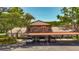 Exterior of a two-story condo building featuring covered parking at 2442 Enterprise Rd # 6, Clearwater, FL 33763