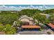 An aerial view of the exterior of a two-story condo building with covered parking at 2442 Enterprise Rd # 6, Clearwater, FL 33763